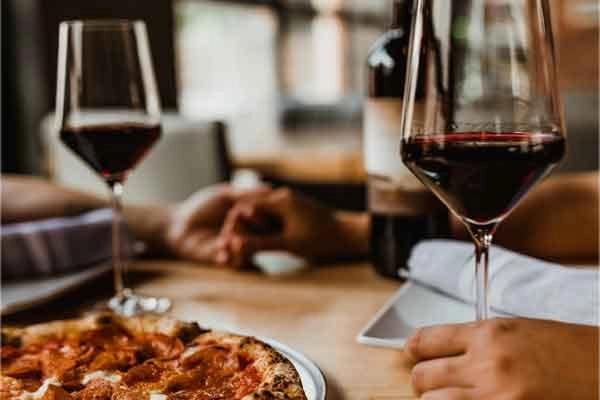 Tuesday Wine & Pizza Night - 50% Off Wine Bottles with Pizza Purchase - Dine In Only.
